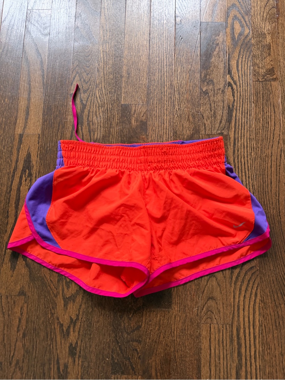 Nike Women's Bright Orange Athletic Shorts with Purple Panels and Pink Trim